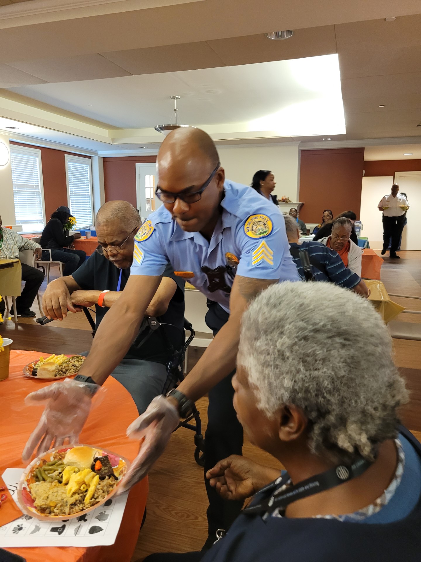 First District Sergeant Feeding the Elderly