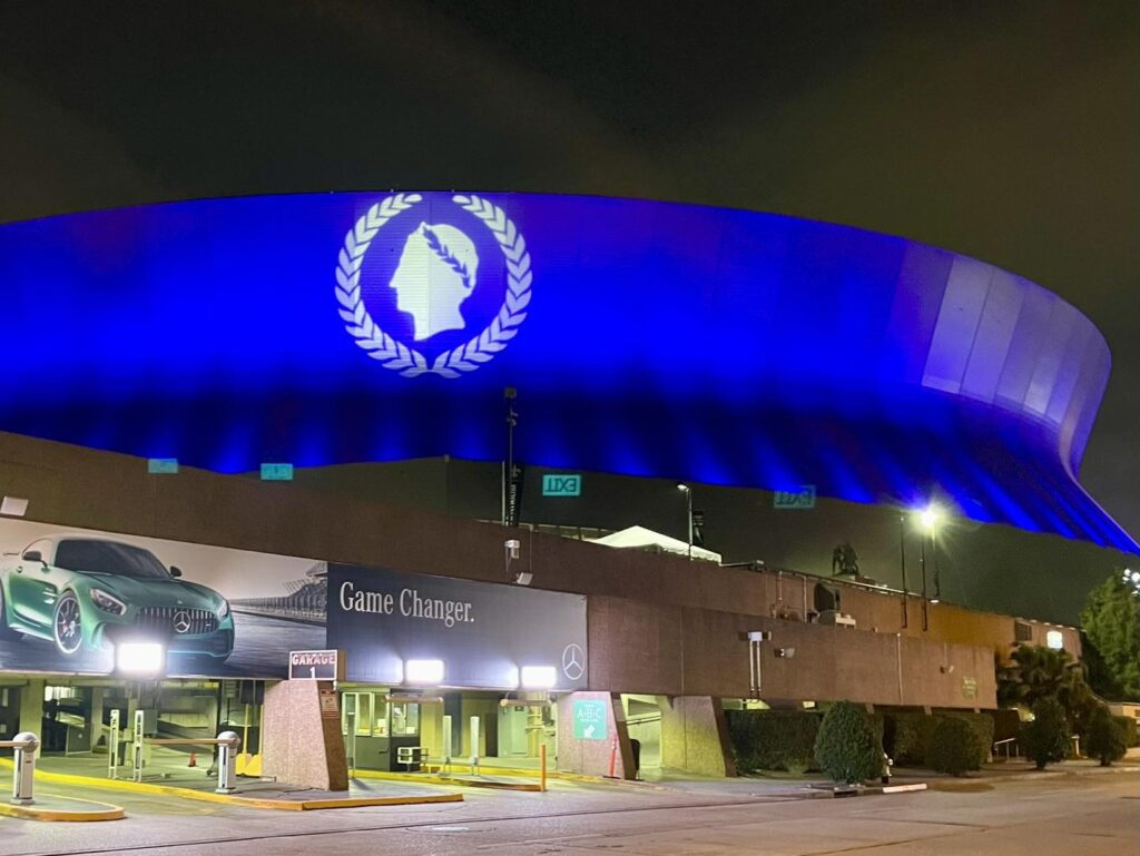 Caesars Superdome in blue light