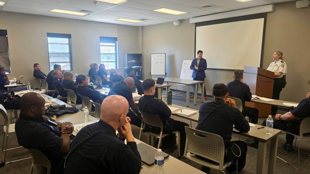 Captain Gwen Nolan teaches career planning to recruits at the NOPD Academy with NOPJF Director Matthew Stone